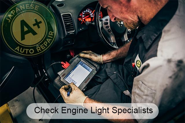 Check engine light specialists - mechanic using scan tool - A+ Japanese Auto Repair Inc.